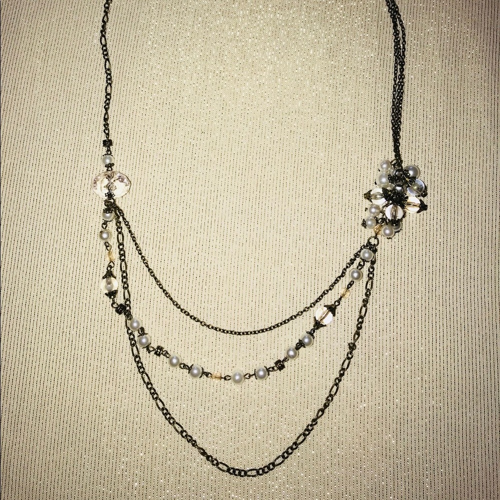Layered necklace with pearl accents.